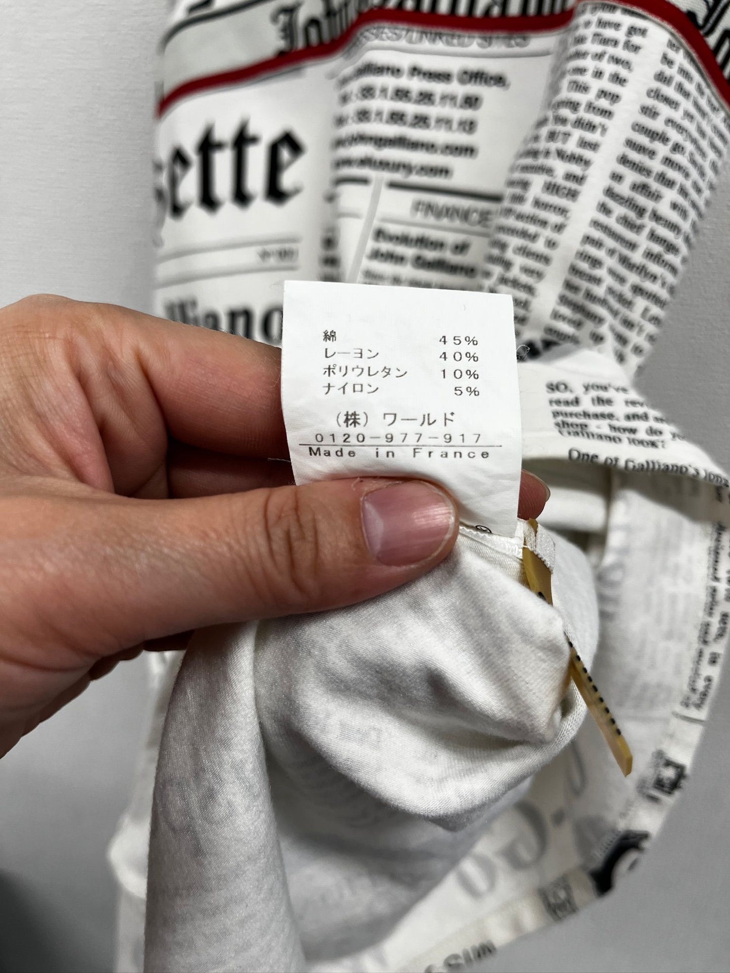 Newspaper/gazette/newspaper print slip dress, an iconic John Galliano design.