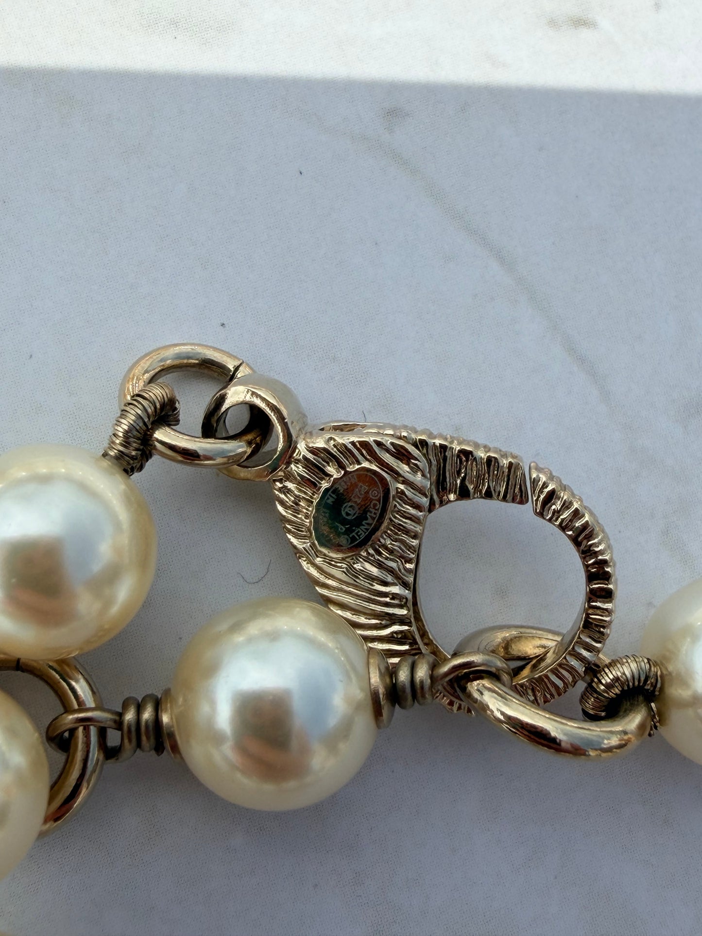 Iconic Chanel Pearl Necklace or Belt featuring the No 5 strass and leather Charm