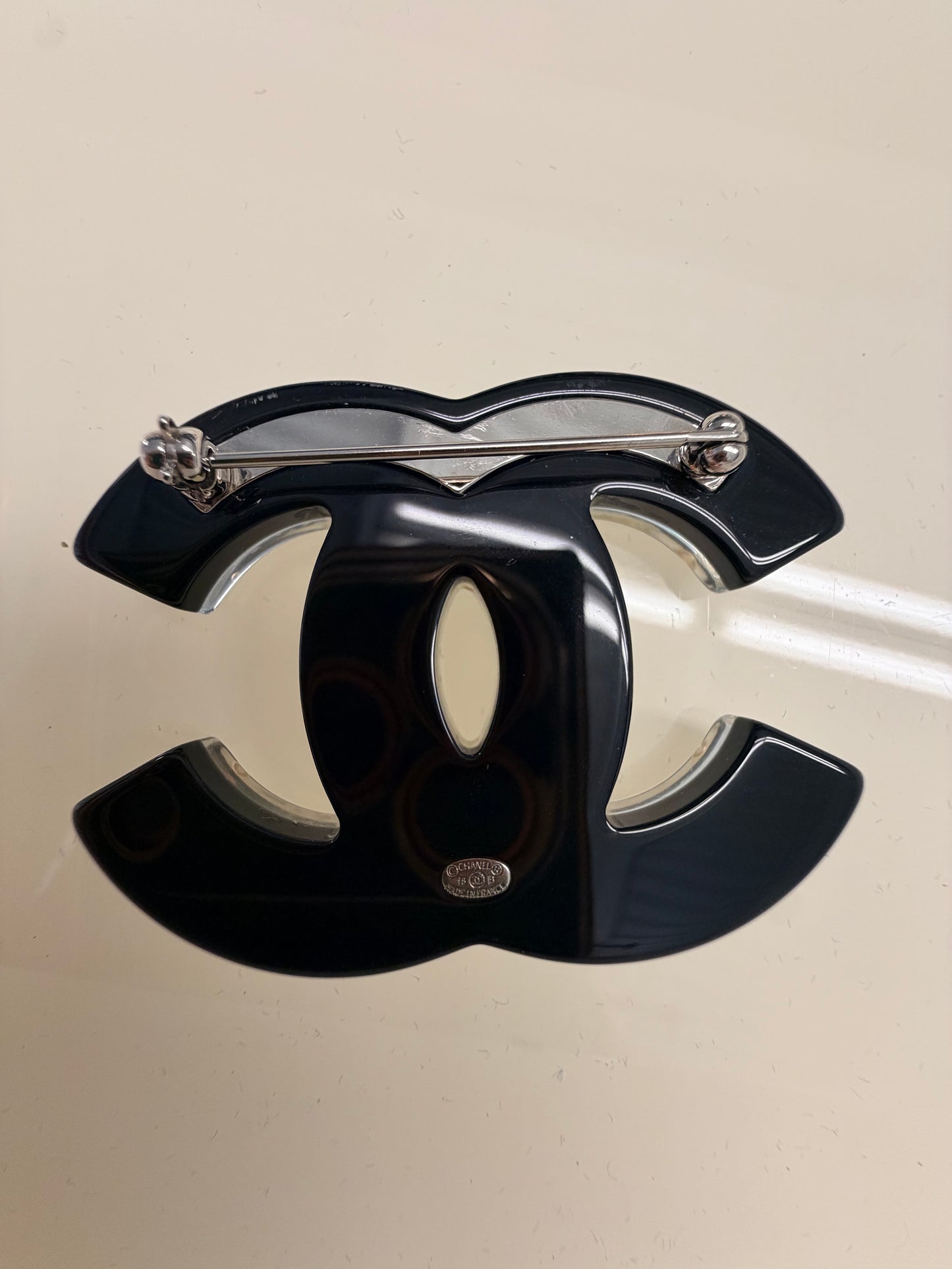 Chanel resin black and white brooch from Fall/Winter 2016 Act 1 (16B) Collection