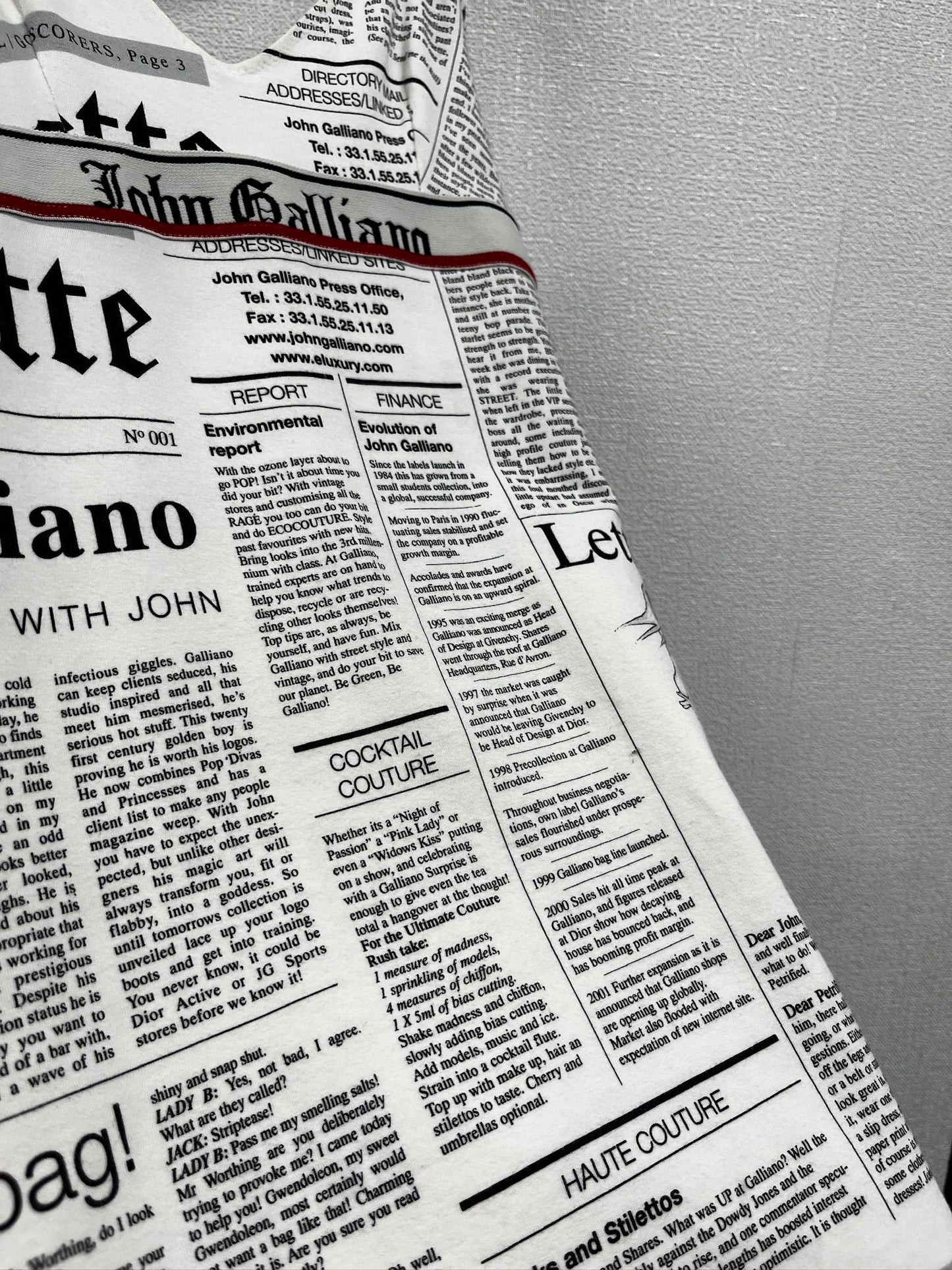 Newspaper/gazette/newspaper print slip dress, an iconic John Galliano design.