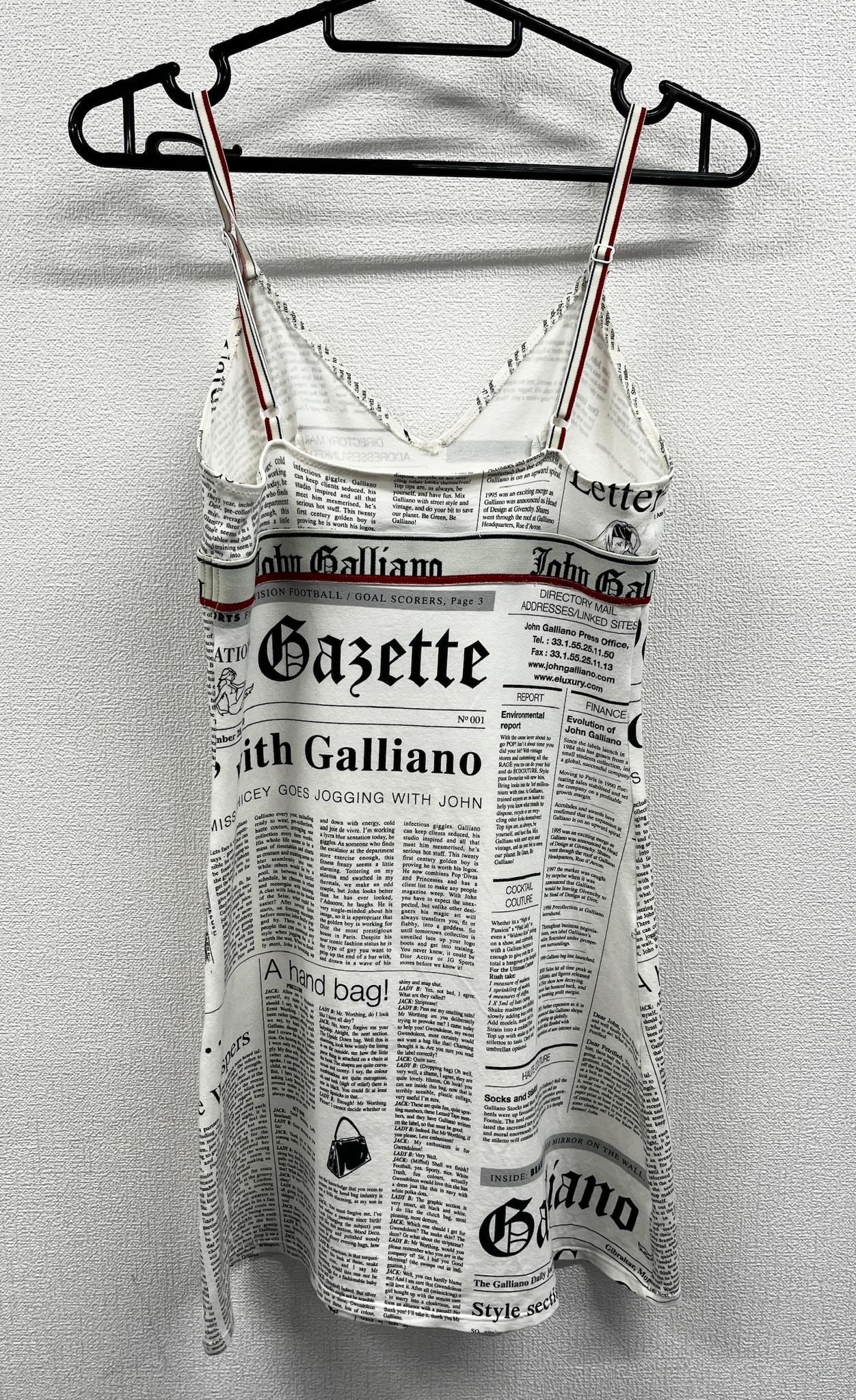Newspaper/gazette/newspaper print slip dress, an iconic John Galliano design.