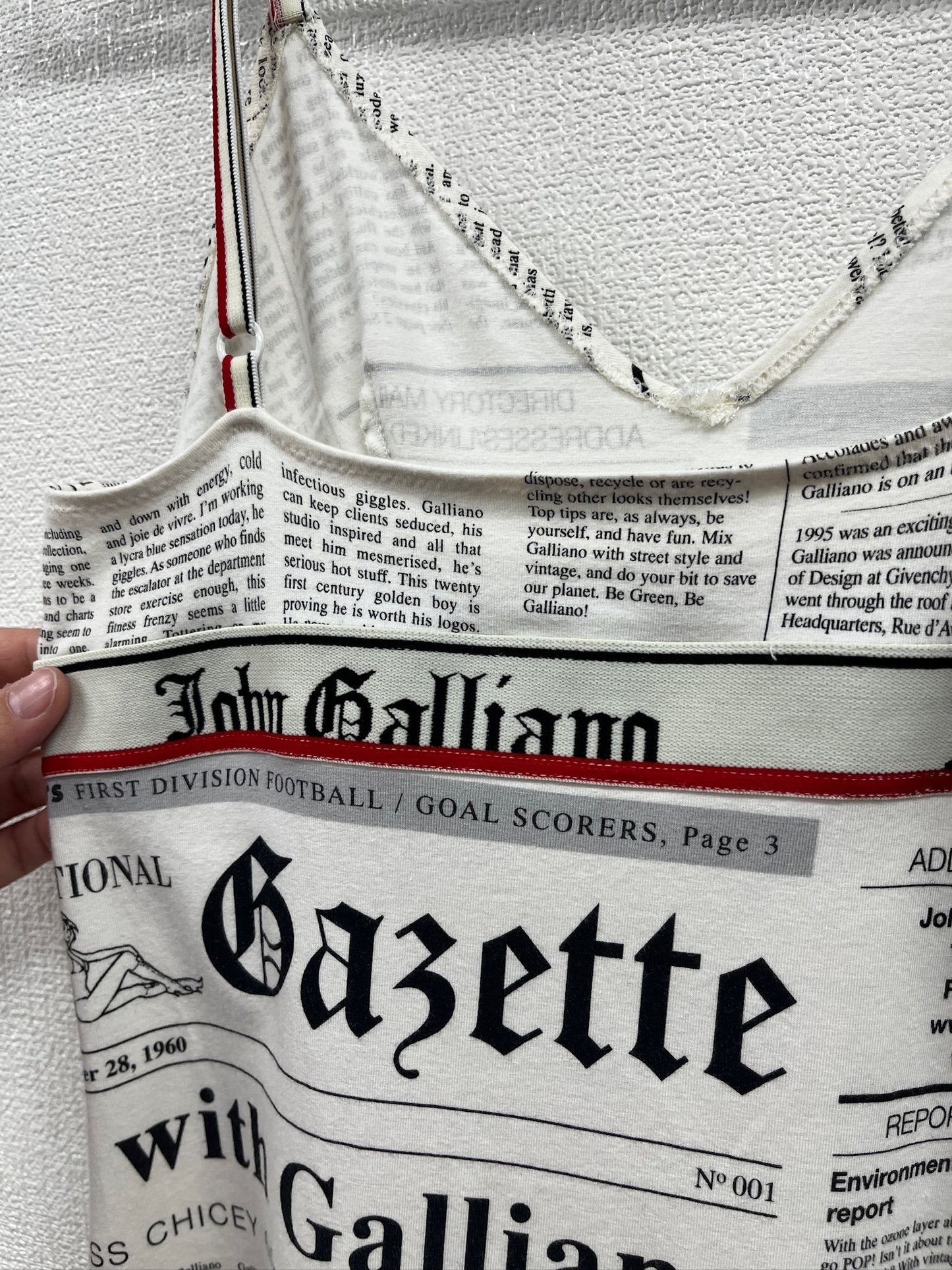 Newspaper/gazette/newspaper print slip dress, an iconic John Galliano design.