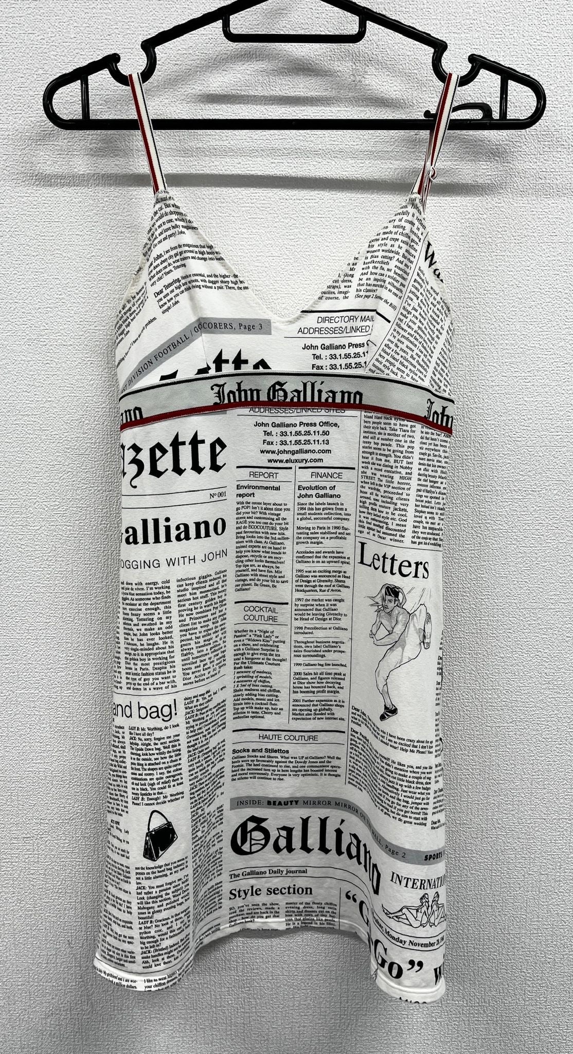 Newspaper/gazette/newspaper print slip dress, an iconic John Galliano design.