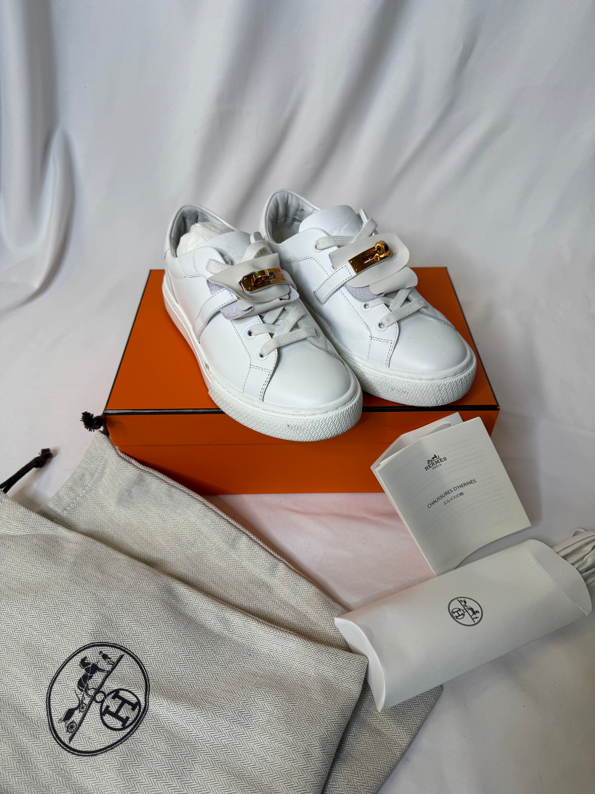 Hermes’ Day Kelly Buckle sneakers in rose gold in size 37.5