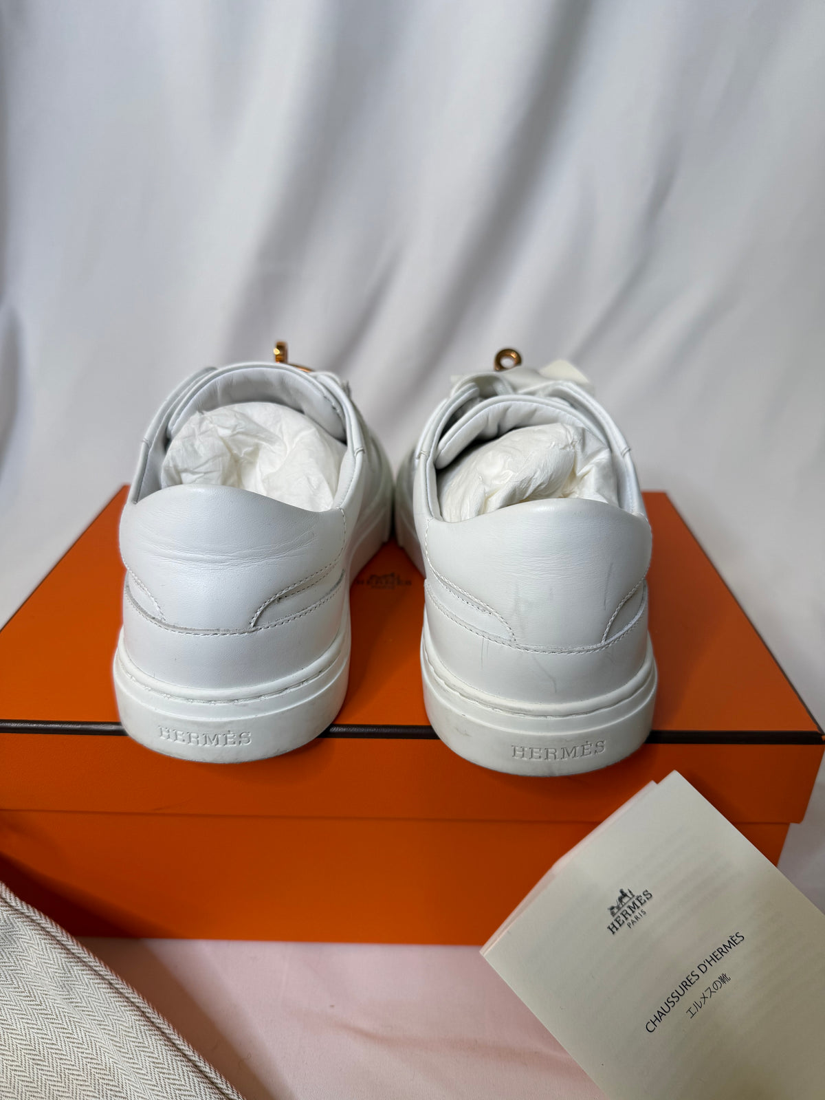 Hermes’ Day Kelly Buckle sneakers in rose gold in size 37.5