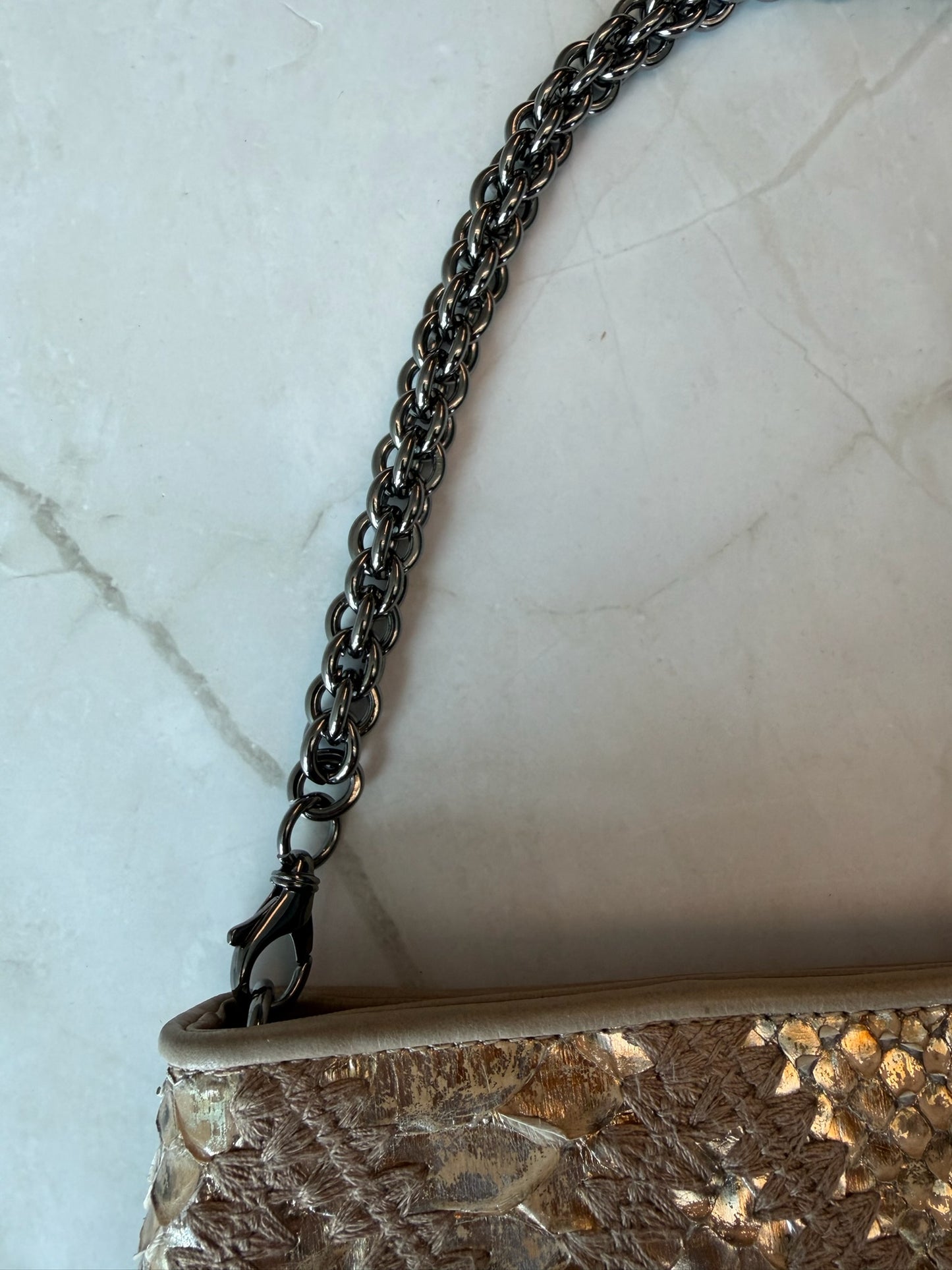 Chanel Gold Python Clutch with gunmetal hardware and big logo zipper pull