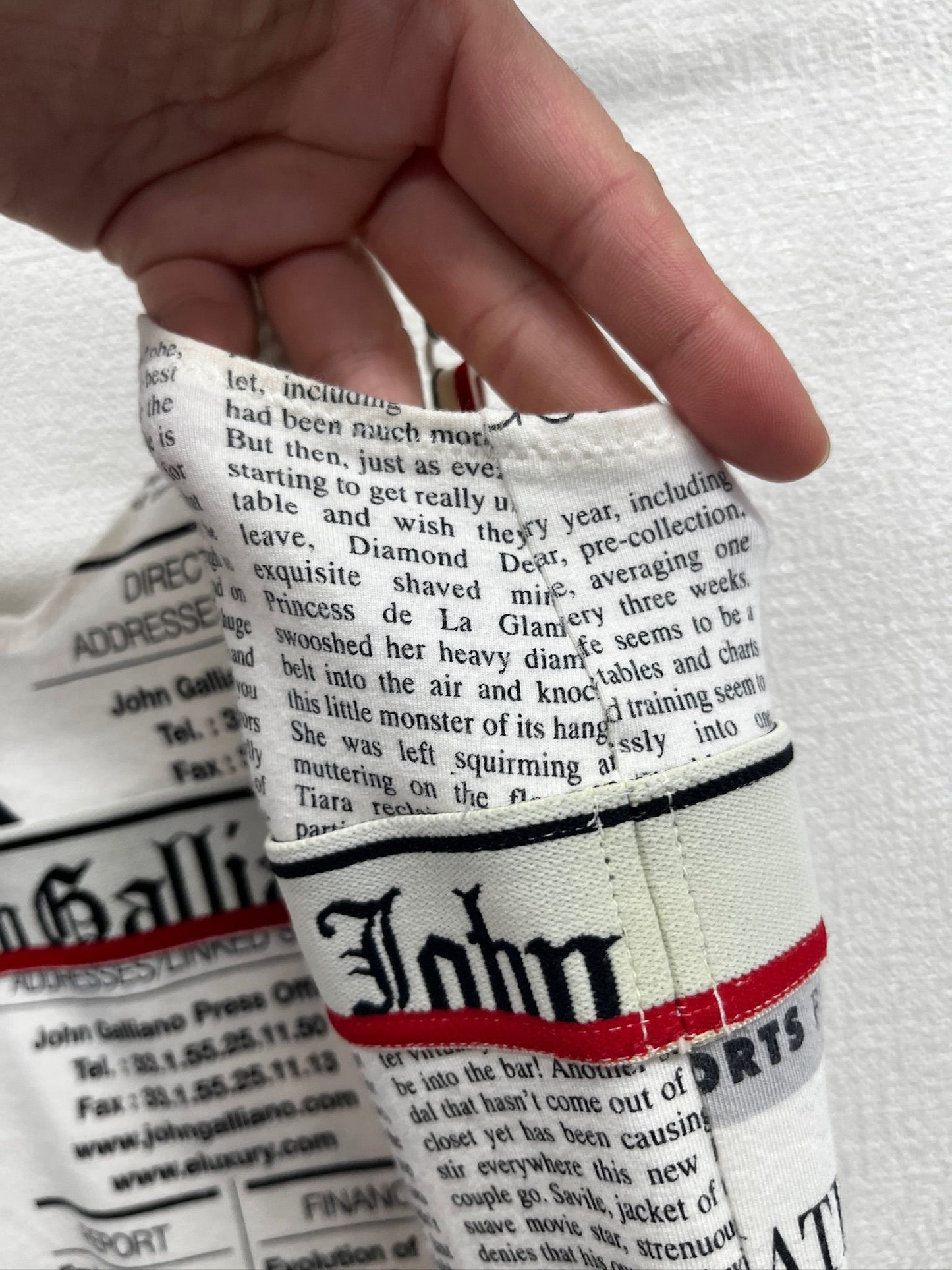 Newspaper/gazette/newspaper print slip dress, an iconic John Galliano design.