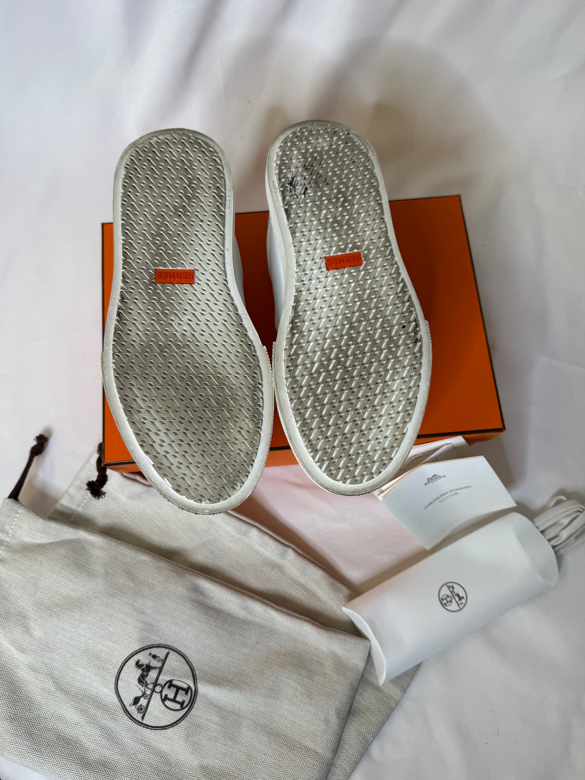 Hermes’ Day Kelly Buckle sneakers in rose gold in size 37.5