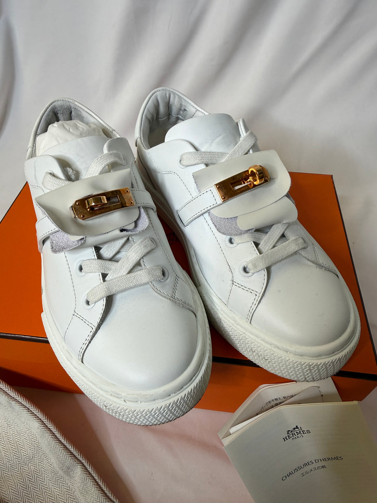 Hermes’ Day Kelly Buckle sneakers in rose gold in size 37.5