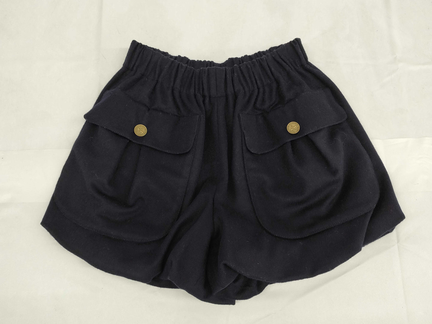 Chanel Navy Wool shorts with pockets and cc buttons.