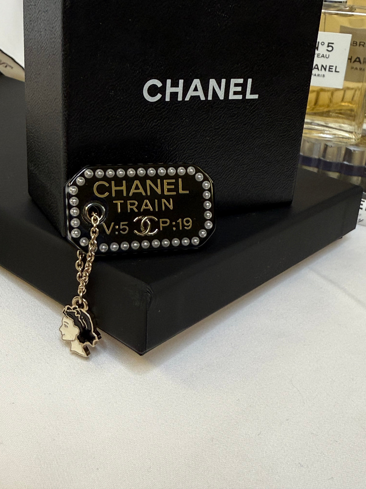 Pre-loved Chanel Black Resin Coco Train Ticket Brooch With Charm