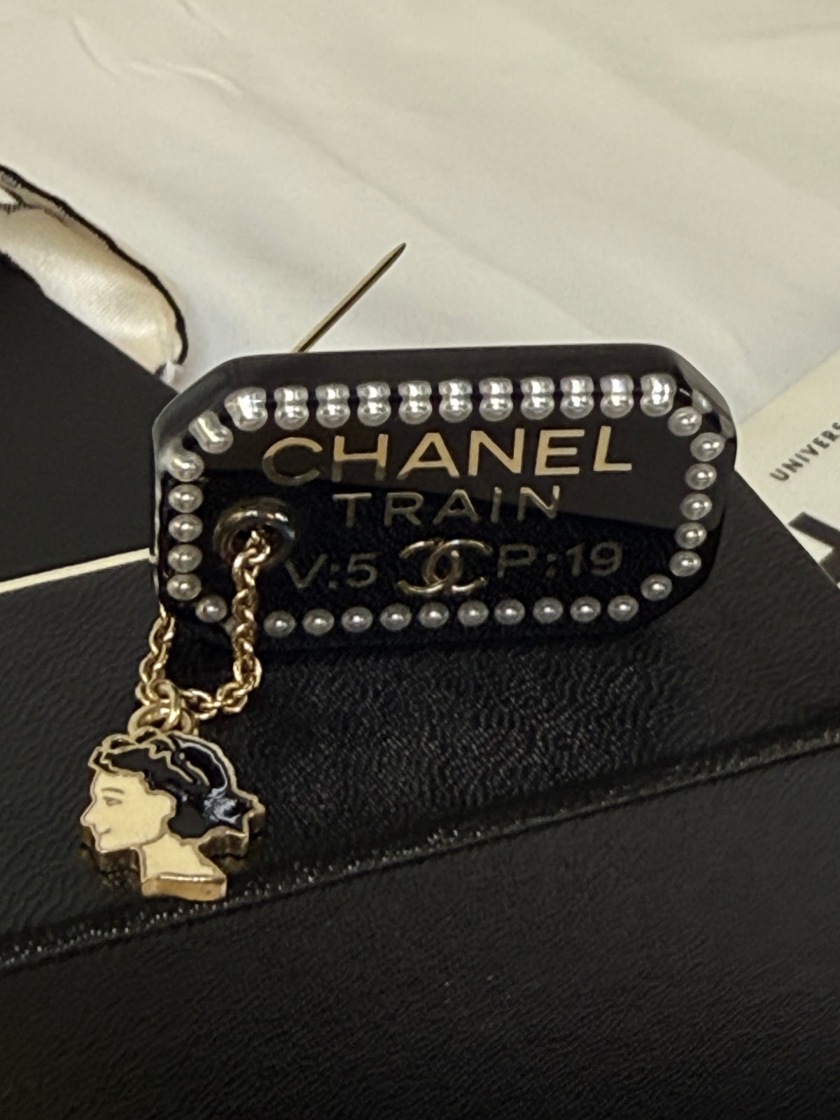 Pre-loved Chanel Black Resin Coco Train Ticket Brooch With Charm