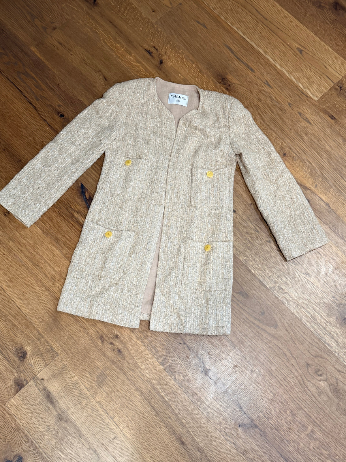 Chanel collarless Tweed Jacket in Beige Gold with CC buttons on pockets