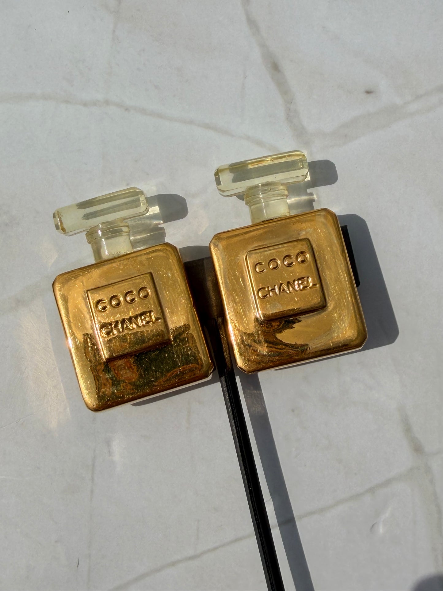 Rare Vintage CHANEL golden perfume bottle clip-on earrings with embossed logo