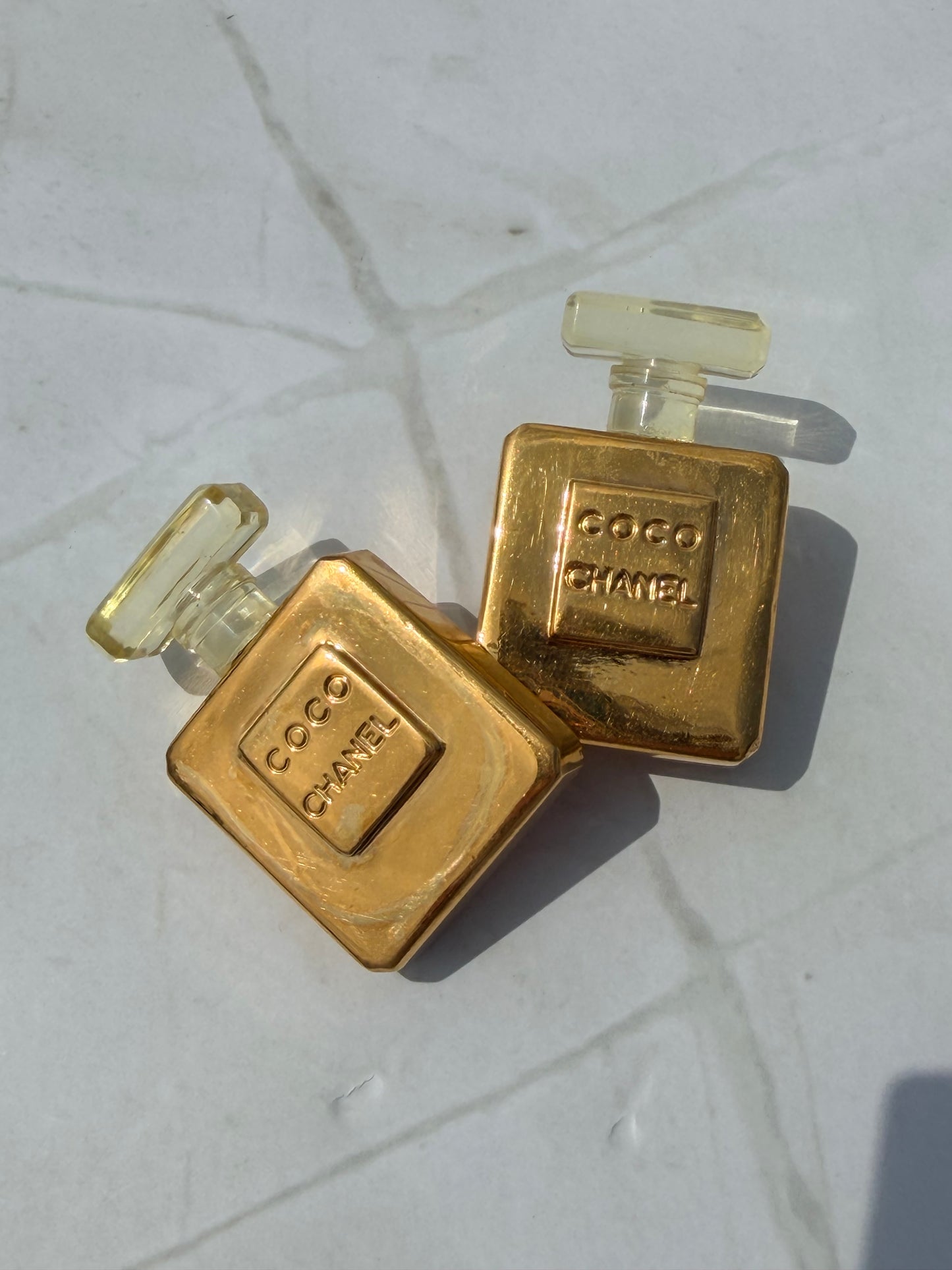 Rare Vintage CHANEL golden perfume bottle clip-on earrings with embossed logo