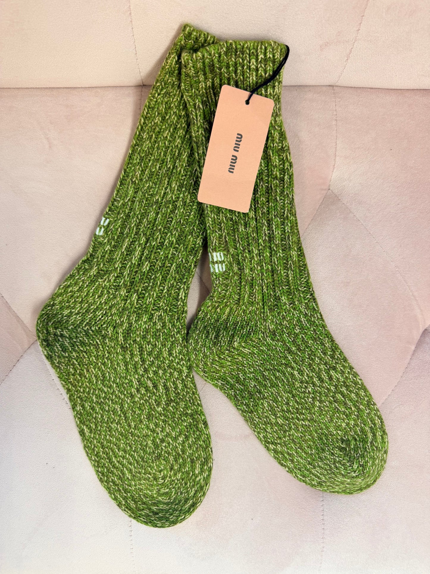Miu Miu ribbed crew socks in a green heathered knit with an embroidered white logo