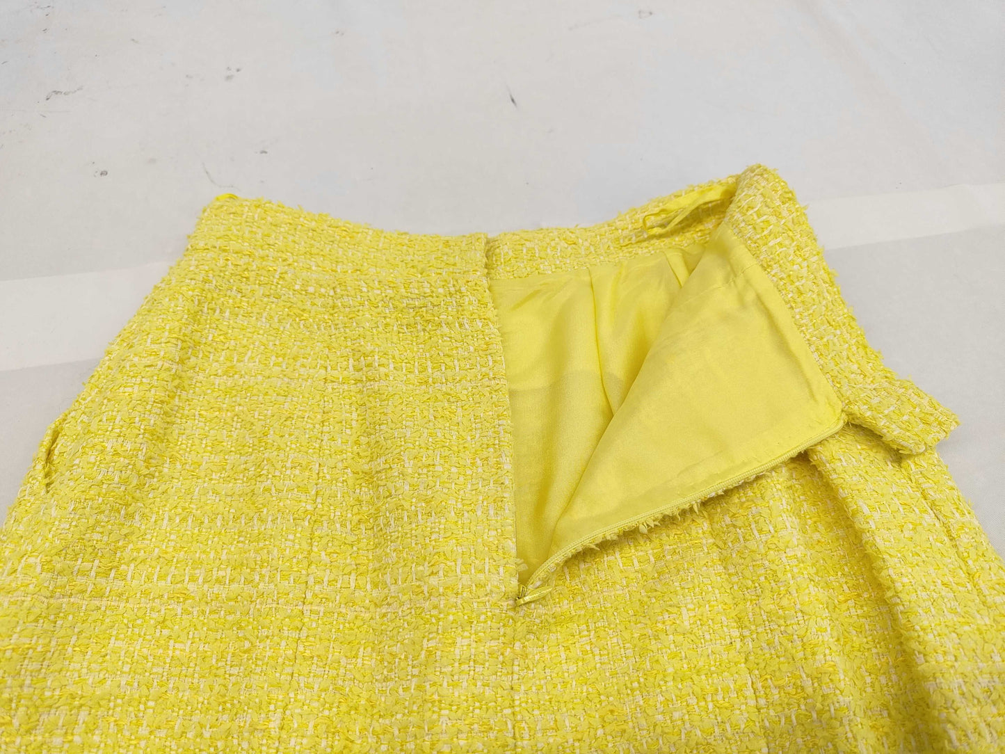Chanel Yellow Tweed skirt with rhinestone CC charm logo